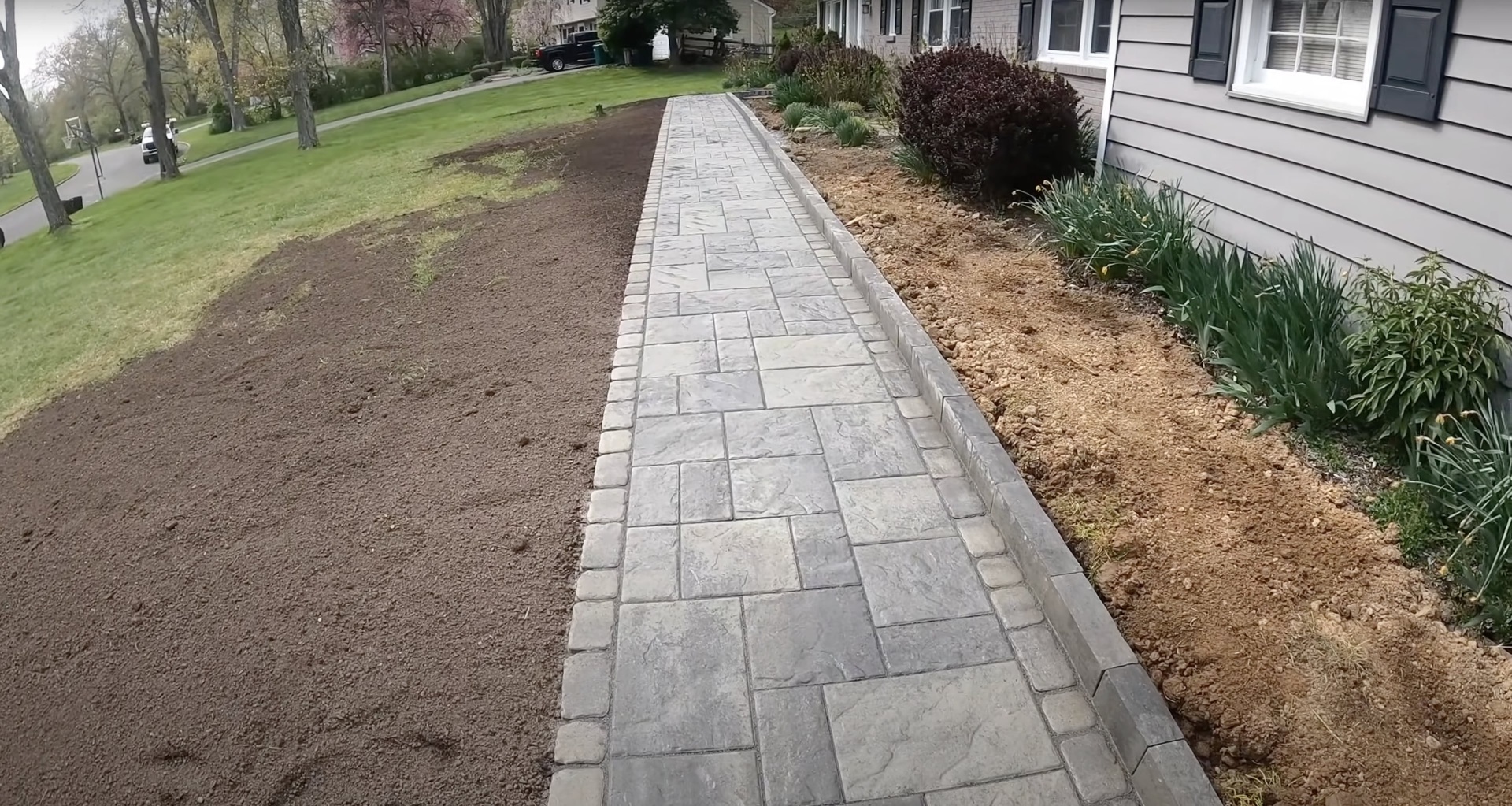 Decorative Concrete Walkway - Stamped Ashlar Pattern Stamped concrete walkway with ashlar pattern leading to home entrance