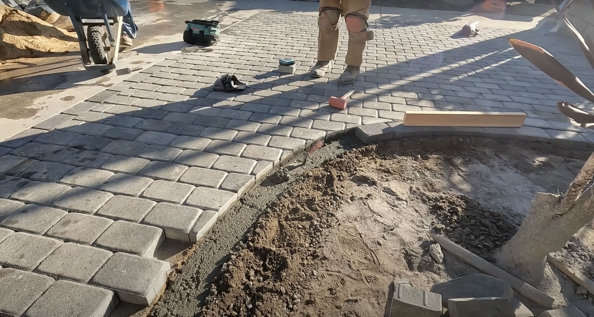 Professional Paver Installation Process - Expert Construction Methods Concrete paver installation in progress showing professional construction techniques