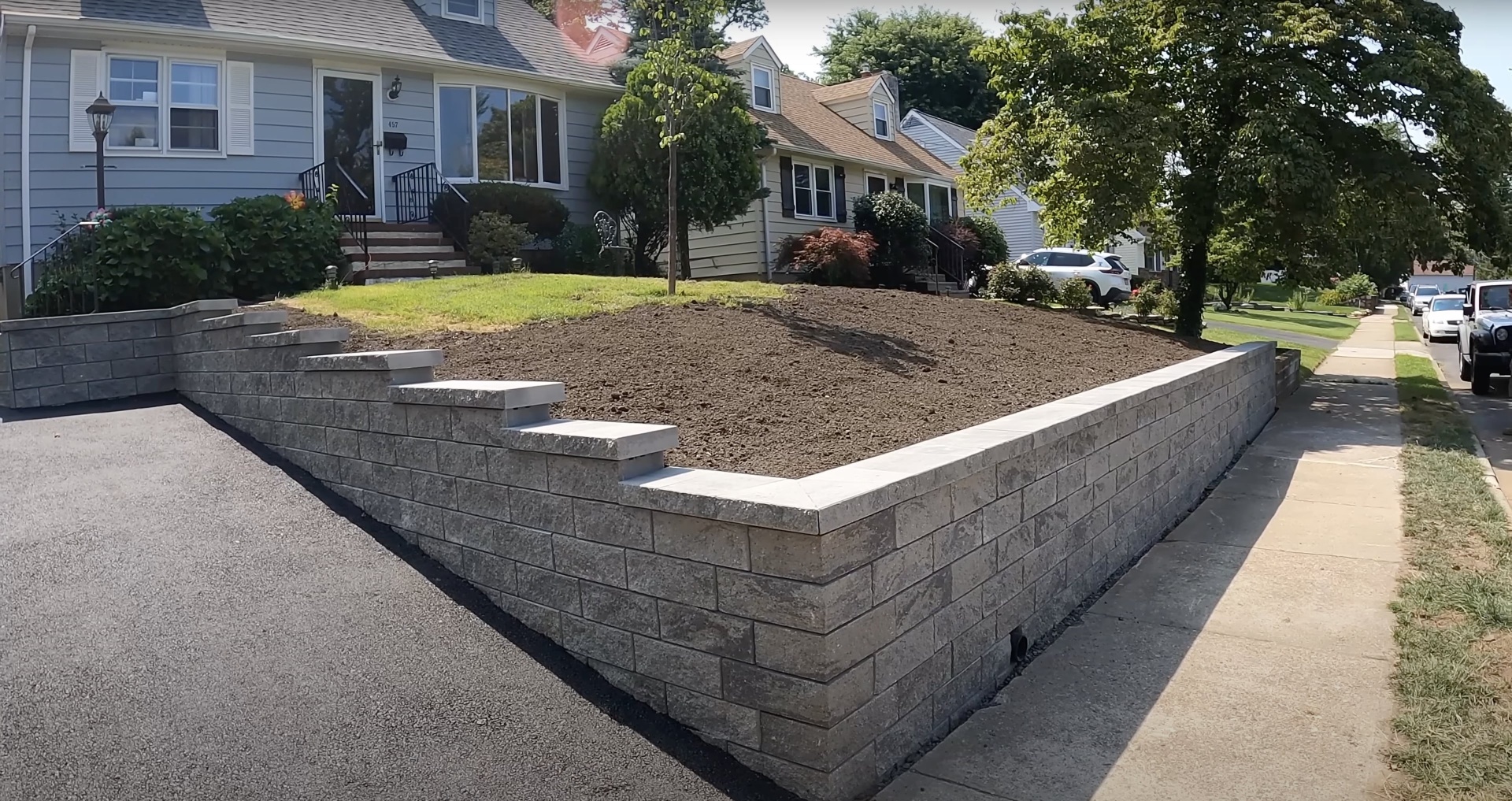 Expert Concrete Construction - Retaining Walls and Landscaping Professional concrete retaining wall construction showing expert craftsmanship in Somerville